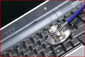 stethoscope on laptop keyboard